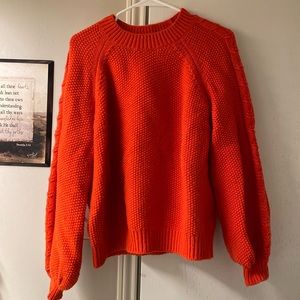 Women’s orange sweater